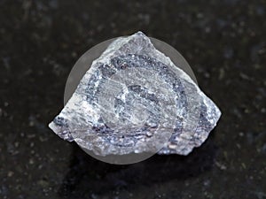 raw stibnite (antimonite) ore on dark