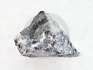 raw stibnite (antimonite) ore on white marble