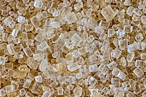 Raw Sugar aka demerara sugar - macro photography of demerara sugar grains in extreme increase.
