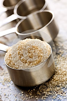 Raw Sugar in Measuring Spoon