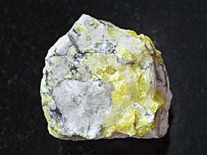 raw sulfur ore on dark background