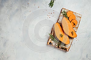Raw sweet potatoes or batatas on light background. banner, menu, recipe place for text, top view