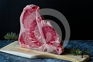 Raw T-bone steak on the kitchen table