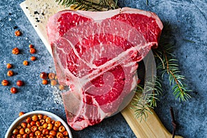 Raw T-Bone Steak with pepper ready to cooking