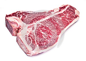 Raw T-bone steak on the white.