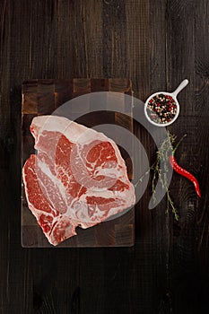 Raw t bones steak on a cutting board