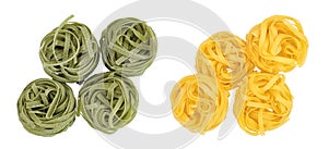Raw tagliatelle green and yellow pasta with spinach isolated on white background. Top view. Flat lay