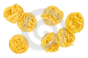 Raw tagliatelle pasta isolated on white background. Top view. Flat lay. Set or collection