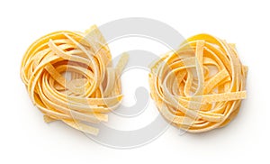 Raw Tagliatelle Pasta Nests Isolated On White Background