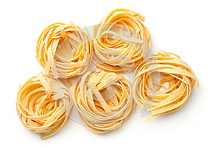 Raw Tagliatelle Pasta Nests Isolated On White Background