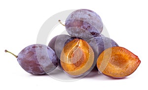 raw tasry plums isolated on white background closeup