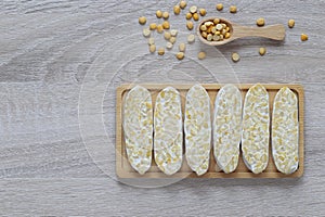 Raw tempeh, Top view of chickpeas tempeh in a bowl on wooder background, Healthy eating concept