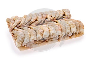 Raw tiger shrimp frozen in large ice cube isolated on white