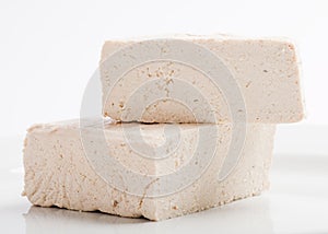 Raw tofu cubes on white background