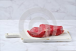 Raw top side beef steak