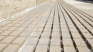 Raw traditional Indonesian bricks being dried in the sun