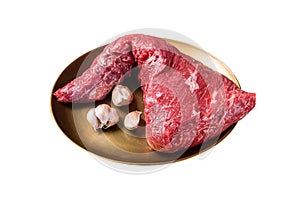 Raw tri-tip triangle roast or bottom sirloin steak on plate with herbs. Isolated on white background. Top view.