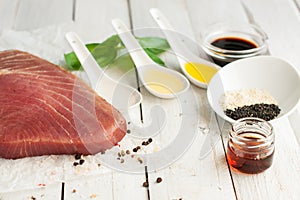 Raw tuna steak with condiments