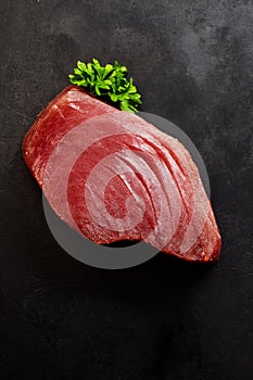 Raw Tuna Steak with Fresh Green Herb Garnish