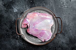 Raw Turkey boneless and skinless thigh fillet. Farm eco meat. Black background. Top view