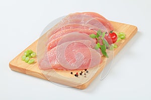 Raw turkey breast steaks