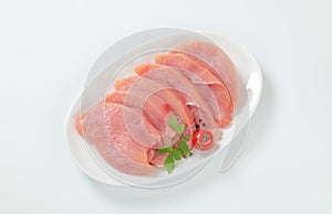 Raw turkey breast steaks