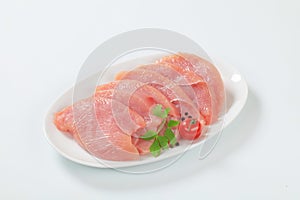 Raw turkey breast steaks