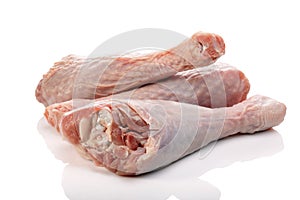 Raw turkey drumsticks or legs isolated on white