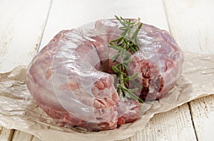 Raw turkey neck with rosemary