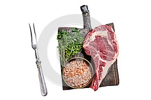 Raw uncooked black angus beef cowboy or rib eye steak. Isolated, white background.