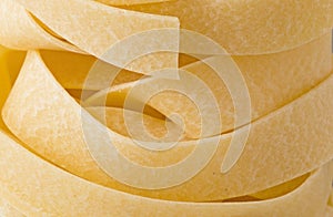 Raw uncooked italian pappardelle pasta noodle photo