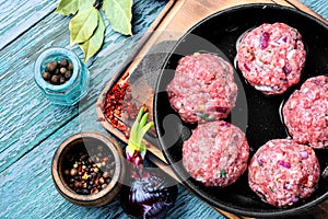 Raw uncooked meatballs