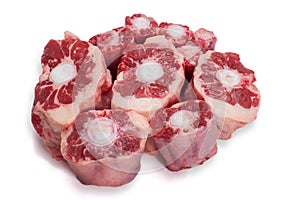Raw uncooked ox tail portions on white