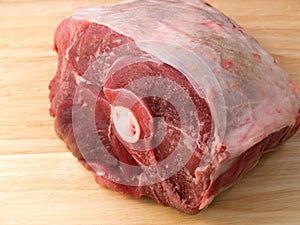 A raw uncooked pork shoulder