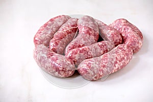 Raw uncooked sausages salsiccia nodi