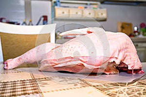 Raw uncooked turkey on table