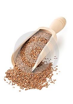 Raw, unprocessed linseed or flax seed in wooden scoop