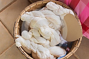 Raw, unprocessed silk yarn from yellow cocoons of the silk