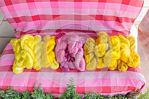 Raw, unprocessed silk yarn from yellow cocoons of the silk