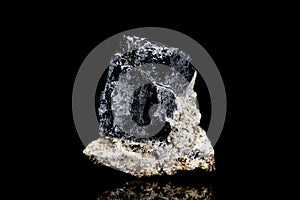 Raw and unrefined galena ore in front of black background