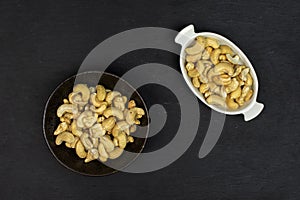 Raw unsalted cashew on grey stone