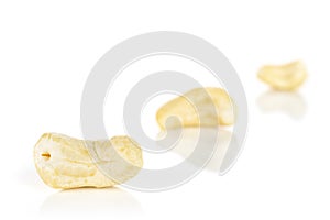 Raw unsalted cashew isolated on white