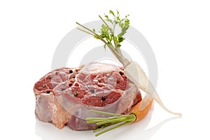 Raw veal shank meat with vegetables.