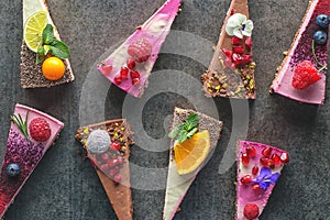 Raw vegan cakes with fruit and seeds, decorated with flower, product photography for patisserie