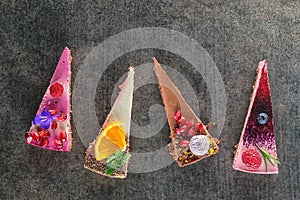 Raw vegan cakes with fruit and seeds, decorated with flower, product photography for patisserie