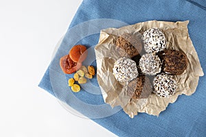 Raw vegan candies c with dried fruit and coconut.