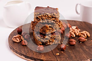 Raw vegan dates oats peanut butter bars with chocolate frosting