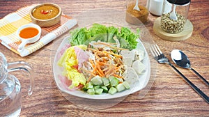 Raw vegetable salad or Asinan Betawi is a traditional food from Indonesia made of cabbage bean sprouts tofu cucumber carrot peanut