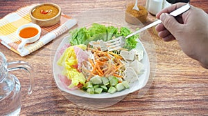 Raw vegetable salad or Asinan Betawi is a traditional food from Indonesia made of cabbage bean sprouts tofu cucumber carrot peanut