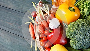 Raw vegetables in basket on table healthy food concept, Top view.